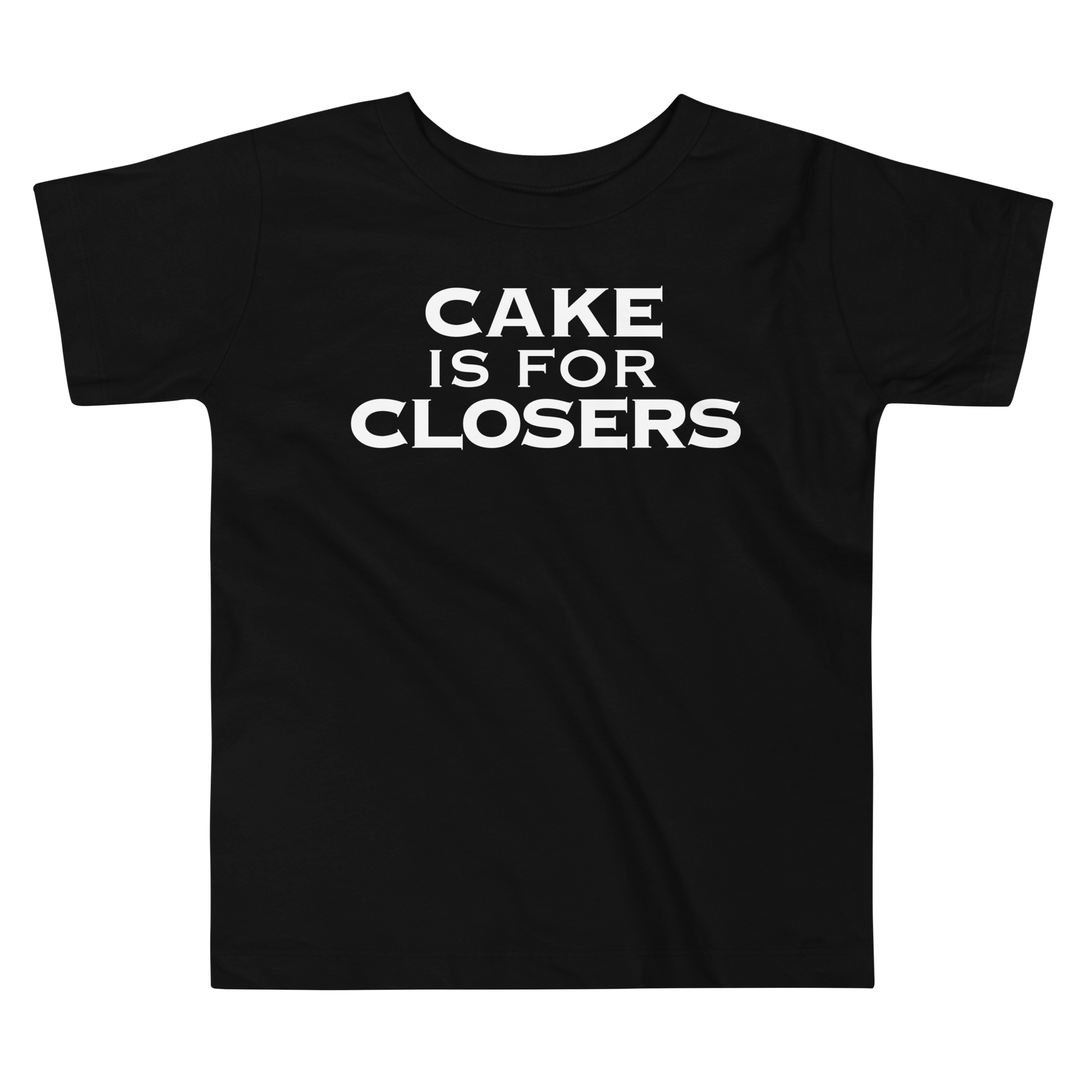 "Cake Is For Closers" printed on a black toddler short sleeve tee laying on a flat surface