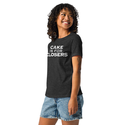 "Cake Is For Closers" printed on a dark grey heather women's relaxed t-shirt worn by a female