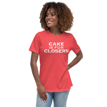 "Cake Is For Closers" printed on a heather red women's relaxed t-shirt worn by a female