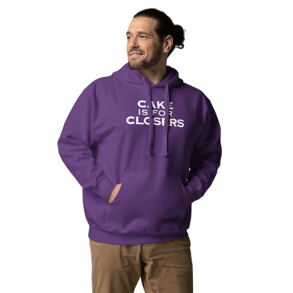 "Cake Is For Closers" printed on a purple unisex hoodie worn by a male
