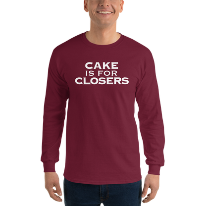 "Cake Is For Closers" printed on a maroon men's long sleeve shirt worn by a male