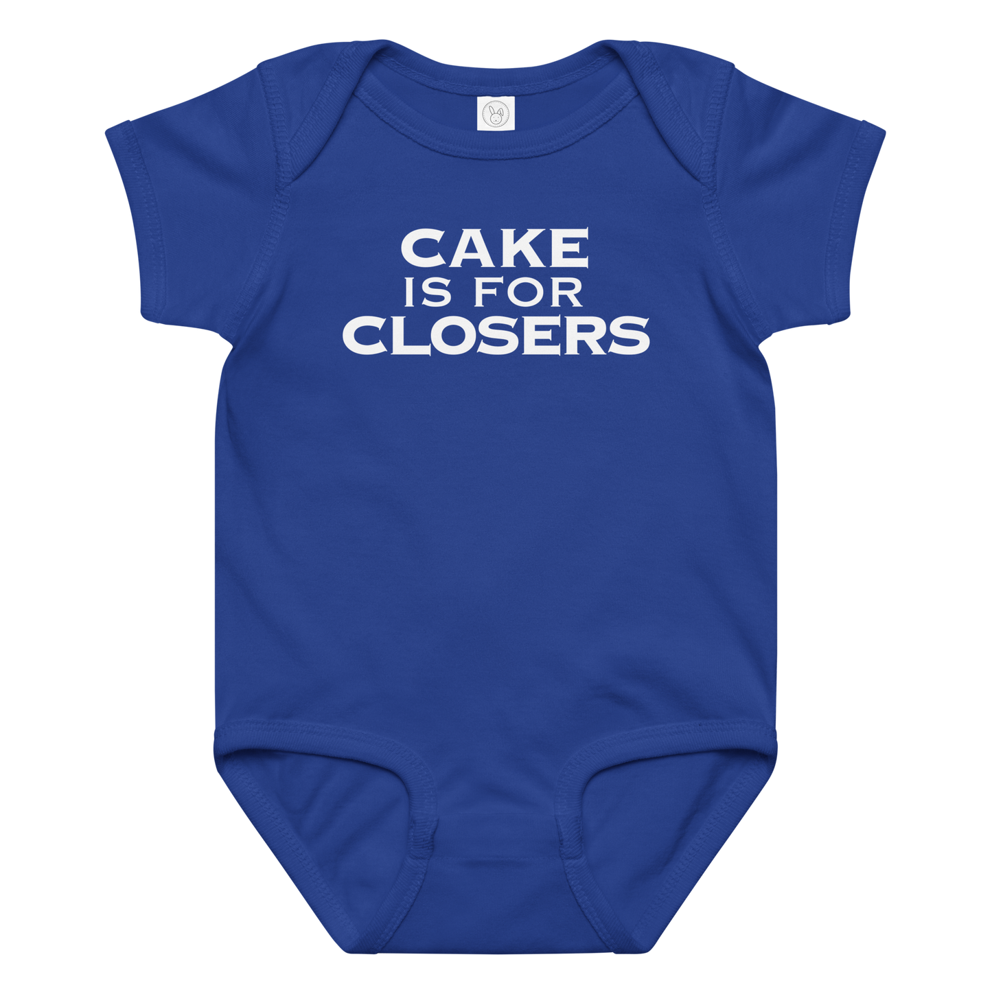 "Cake Is For Closers" printed on a royal baby jersey bodysuit laying on a flat surface amongst other clothes