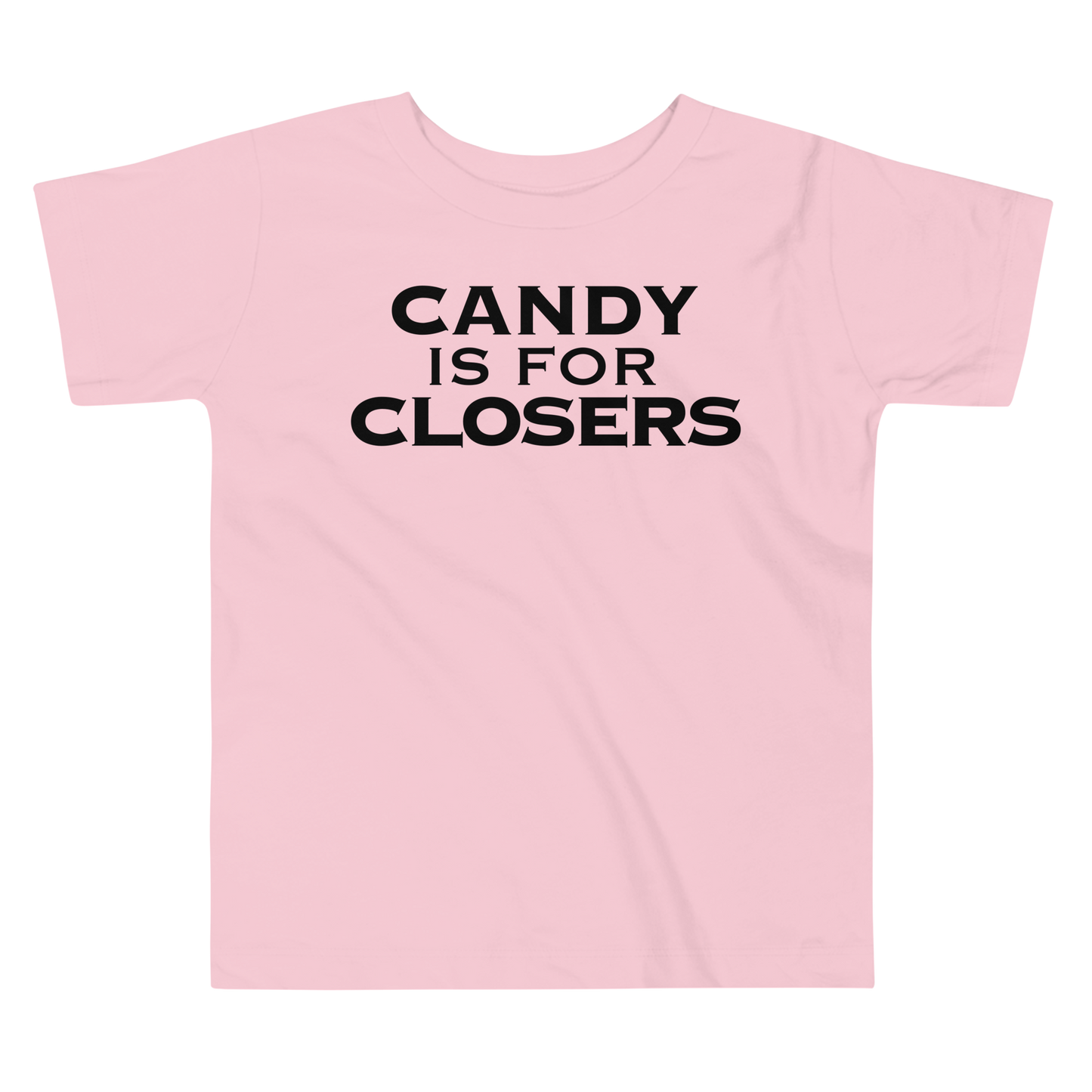 "Candy Is For Closers" printed on a pink toddler short sleeve tee laying on a flat surface
