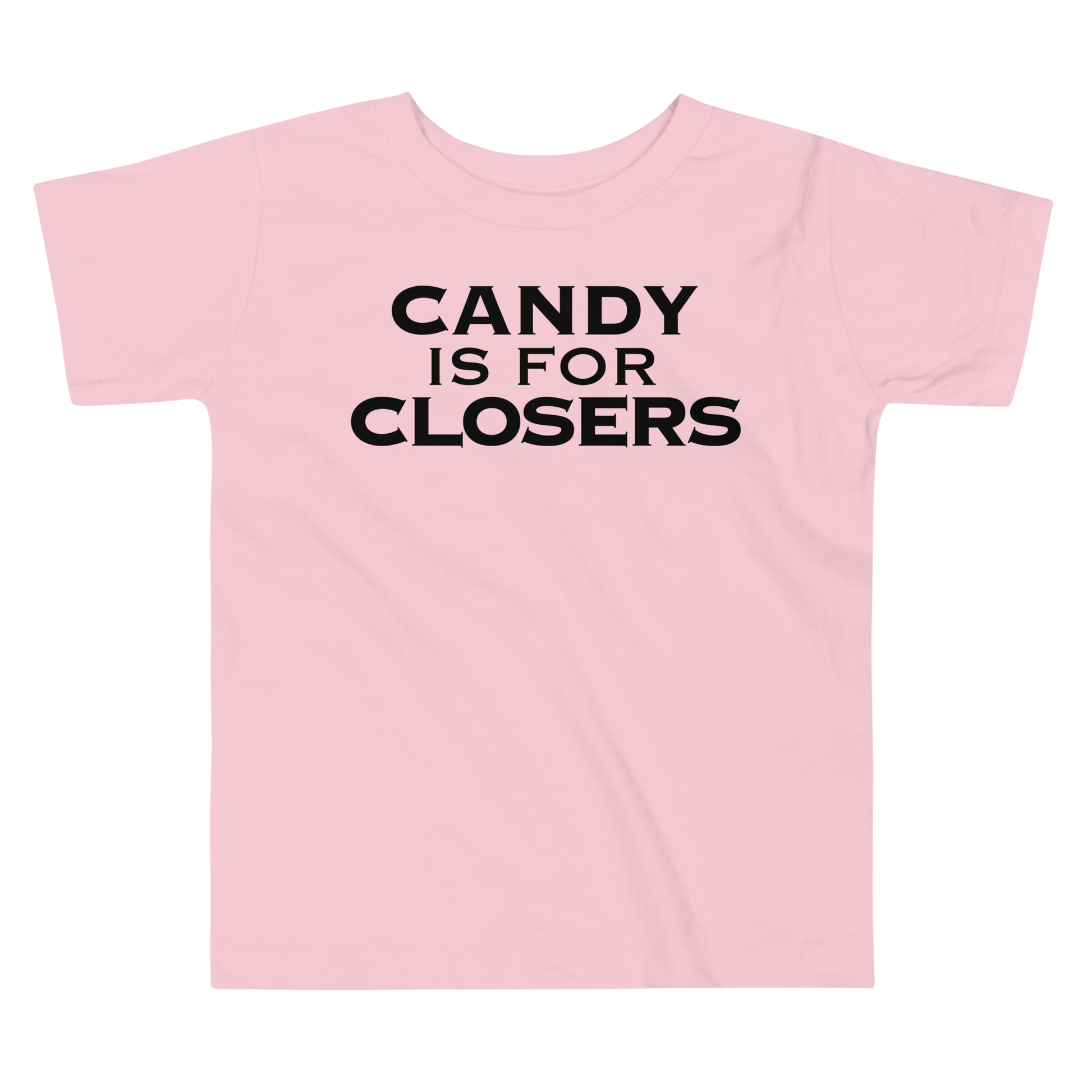 "Candy Is For Closers" printed on a pink toddler short sleeve tee laying on a flat surface