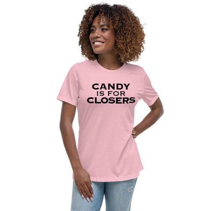 "Candy Is For Closers" printed on a pink women's relaxed t-shirt worn by a female
