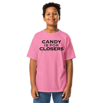 "Candy Is For Closers" printed on a azalea youth classic tee worn by a male
