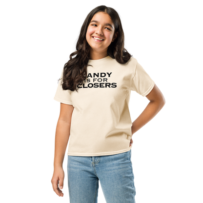 "Candy Is For Closers" printed on a natural youth classic tee worn by a female