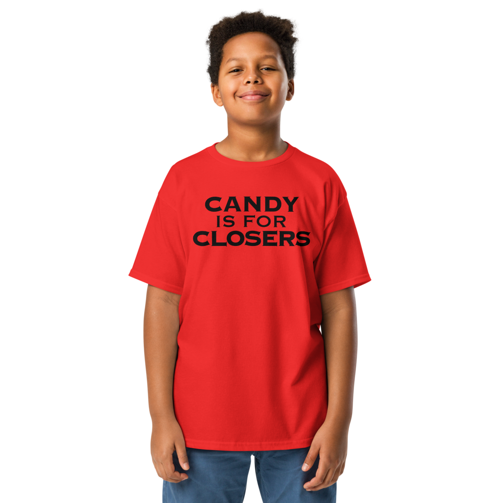 "Candy Is For Closers" printed on a red youth classic tee worn by a male