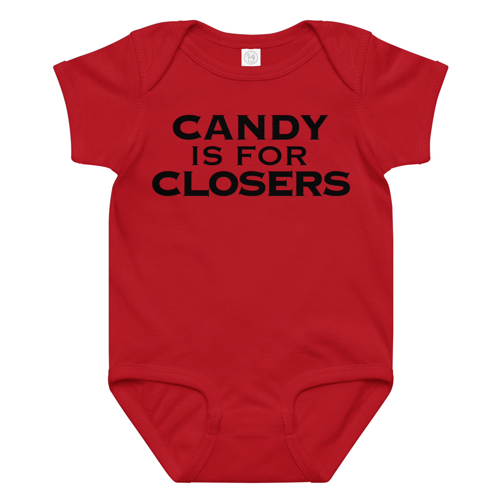 "Candy Is For Closers" printed on a red baby jersey bodysuit laying on a flat surface amongst other clothes
