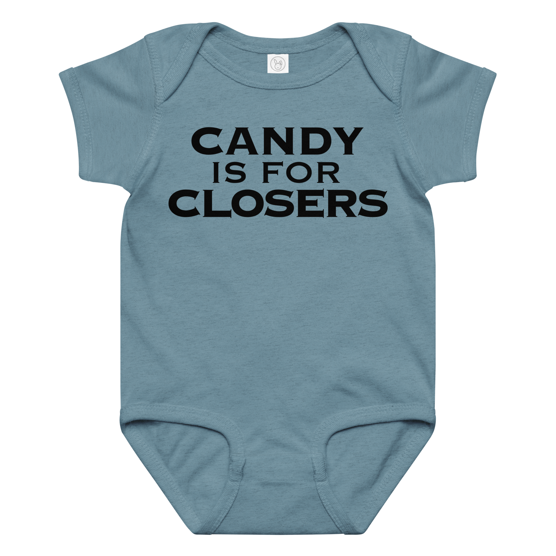 "Candy Is For Closers" printed on a vintage indigo baby jersey bodysuit laying on a flat surface amongst other clothes