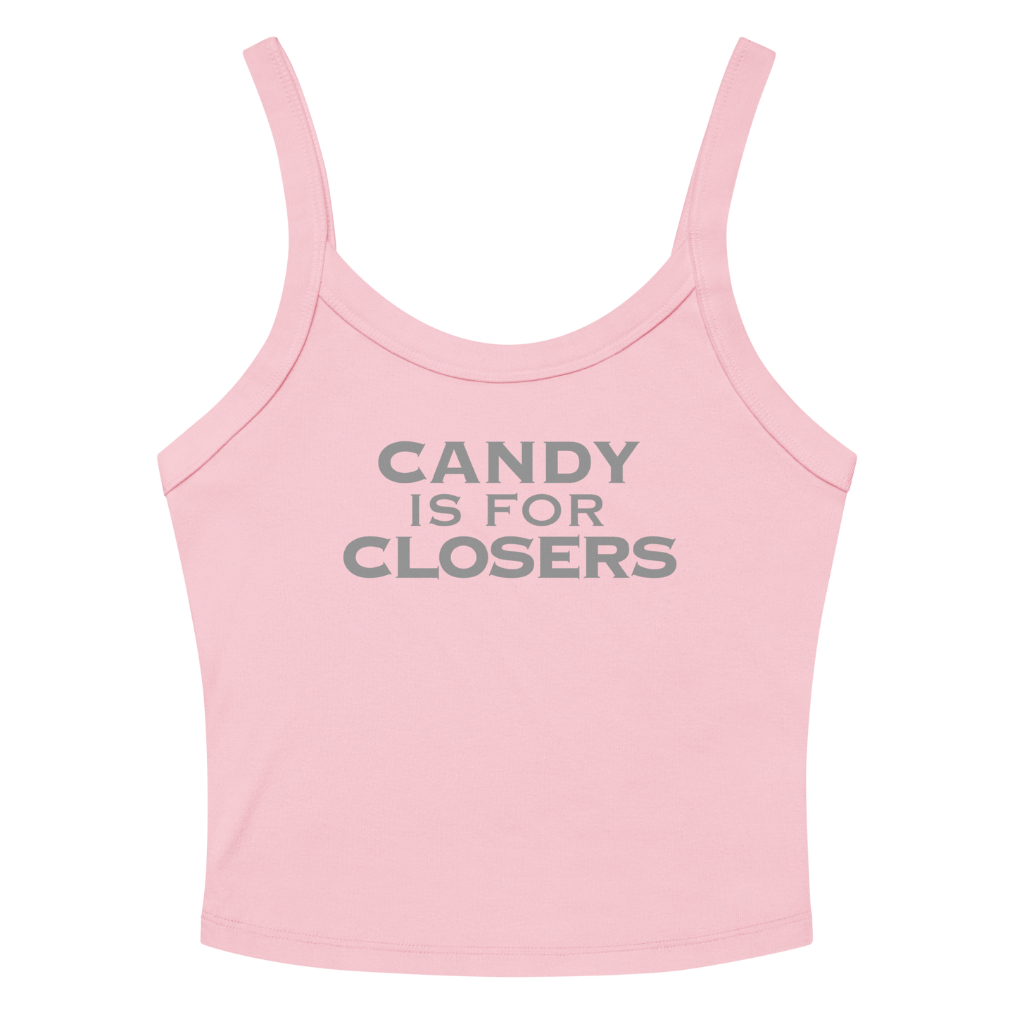 "Candy Is For Closers" printed on a solid pink blend women's micro-rib tanktop laying on a flat surface amongst sunglasses and shorts