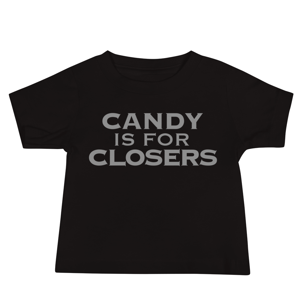 "Candy Is For Closers" printed on a black baby jersey short sleeve tee laying on a flat surface