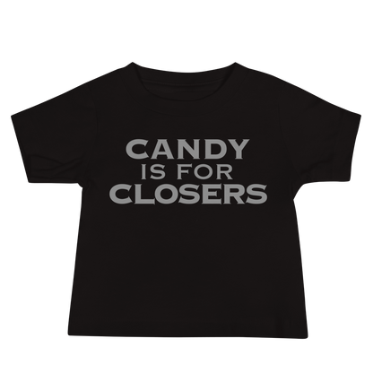 "Candy Is For Closers" printed on a black baby jersey short sleeve tee laying on a flat surface