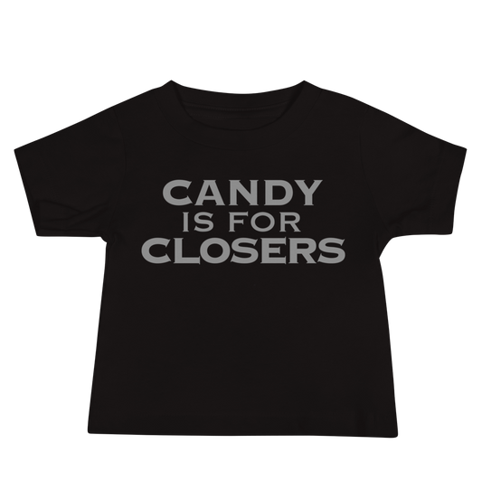 "Candy Is For Closers" printed on a black baby jersey short sleeve tee laying on a flat surface