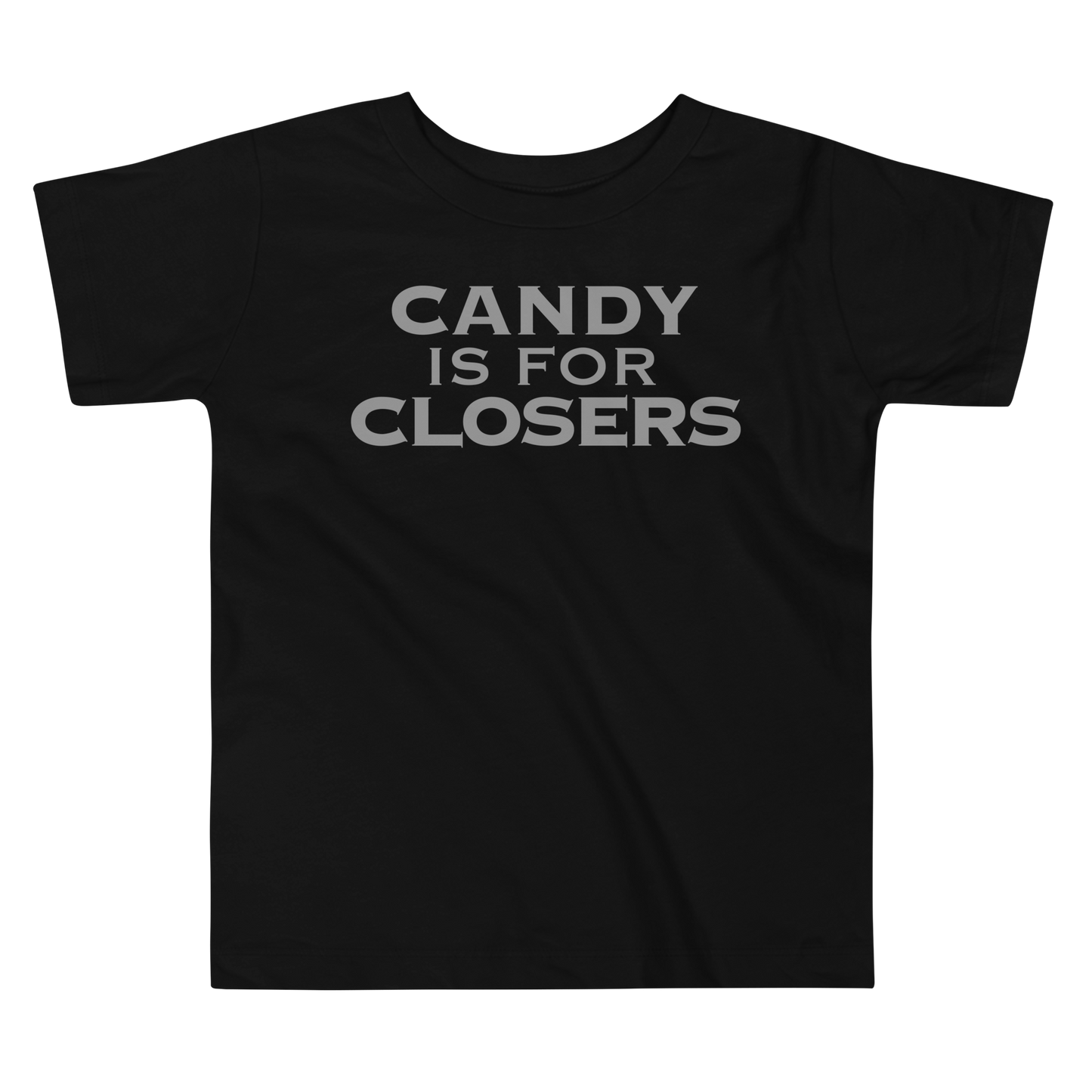 "Candy Is For Closers" printed on a black toddler short sleeve tee laying on a flat surface