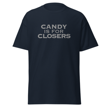 "Candy Is For Closers" printed on a navy unisex classic tee laying on a flat surface