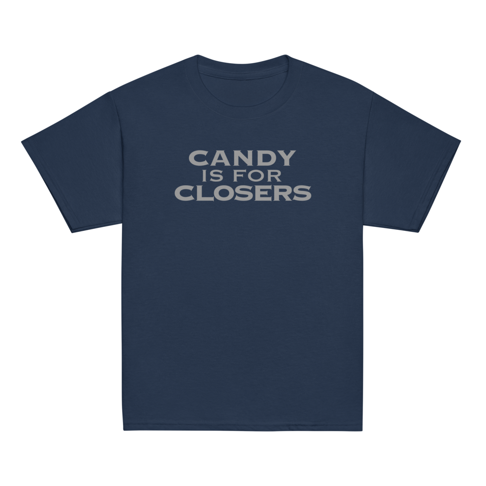"Candy Is For Closers" printed on a navy youth classic tee laying on a flat surface