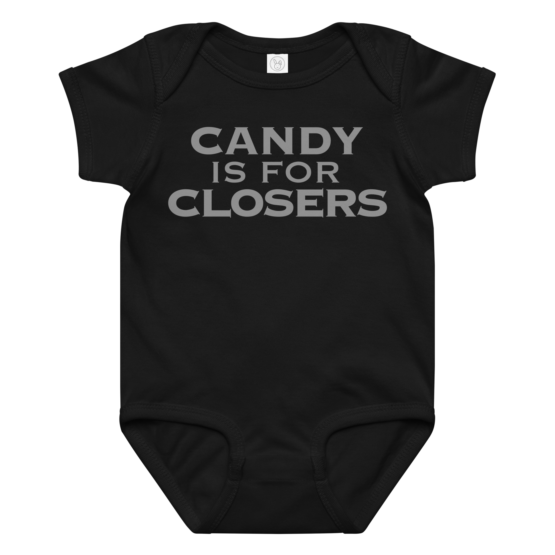 "Candy Is For Closers" printed on a black baby jersey bodysuit laying on a flat surface amongst other clothes