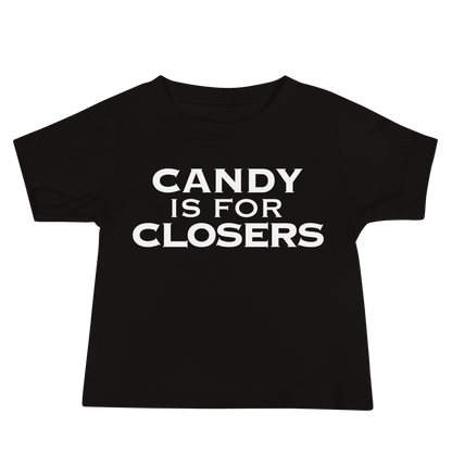 "Candy Is For Closers" printed on a black baby jersey short sleeve tee laying on a flat surface