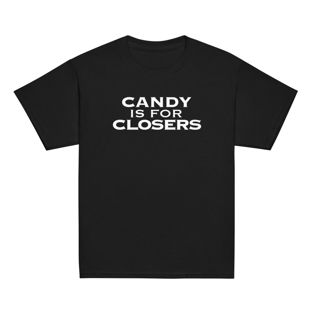 "Candy Is For Closers" printed on a black youth classic tee laying on a flat surface