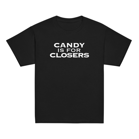 "Candy Is For Closers" printed on a black youth classic tee laying on a flat surface