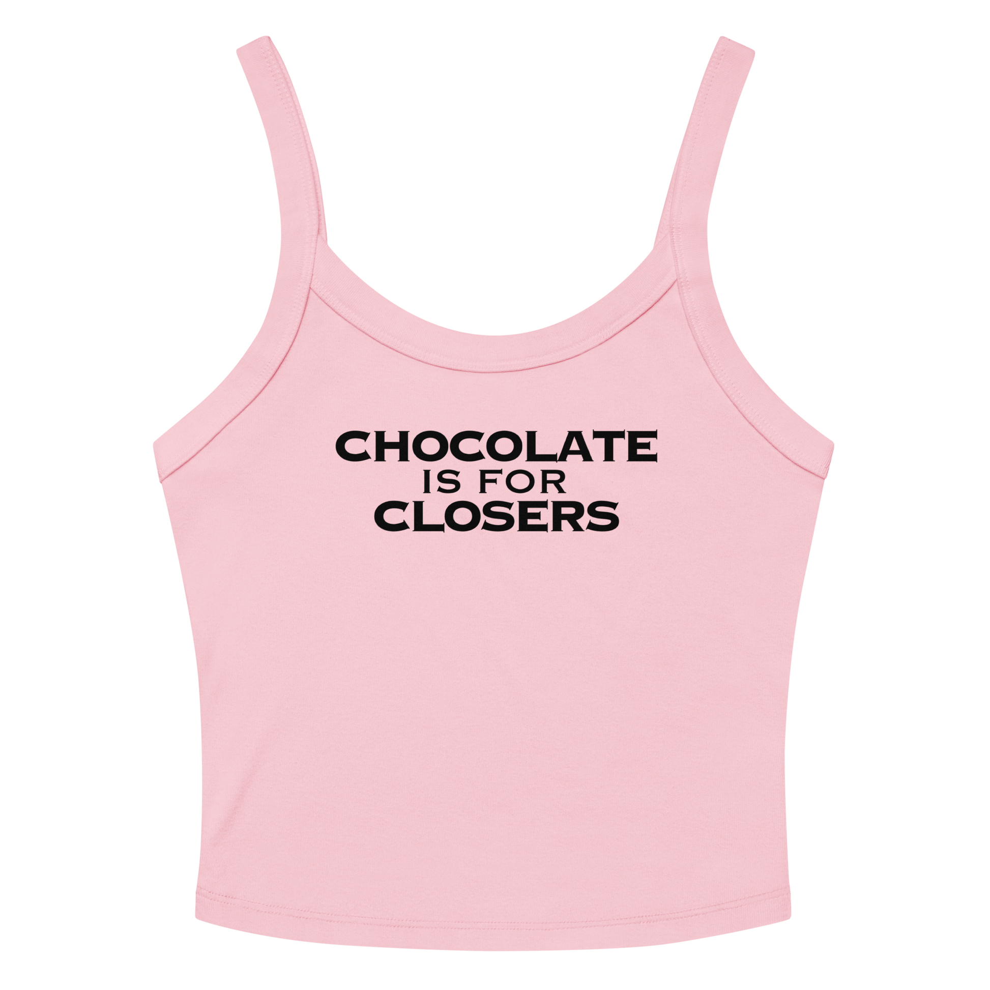 "Chocolate Is For Closers" printed on a solid pink blend women's micro-rib tanktop laying on a flat surface amongst sunglasses and shorts