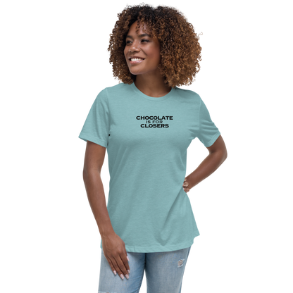 "Chocolate Is For Closers" printed on a heather blue lagoon women's relaxed t-shirt worn by a female