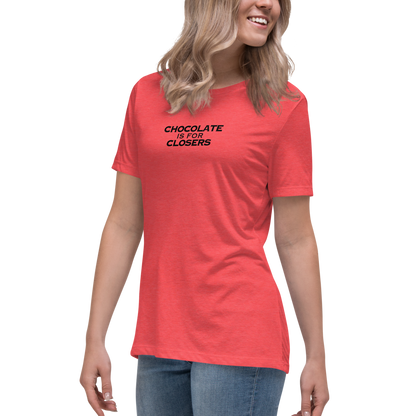 "Chocolate Is For Closers" printed on a heather red women's relaxed t-shirt worn by a female