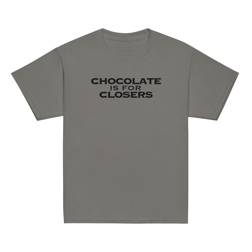 "Chocolate Is For Closers" printed on a charcoal youth classic tee laying on a flat surface