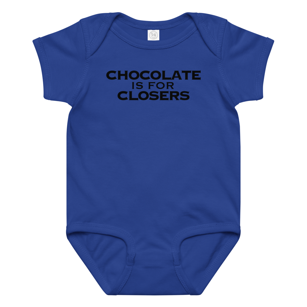 "Chocolate Is For Closers" printed on a royal baby jersey bodysuit laying on a flat surface amongst other clothes
