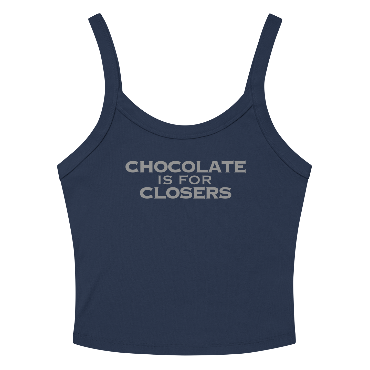 "Chocolate Is For Closers" printed on a solid navy blend women's micro-rib tanktop laying on a flat surface amongst sunglasses and shorts