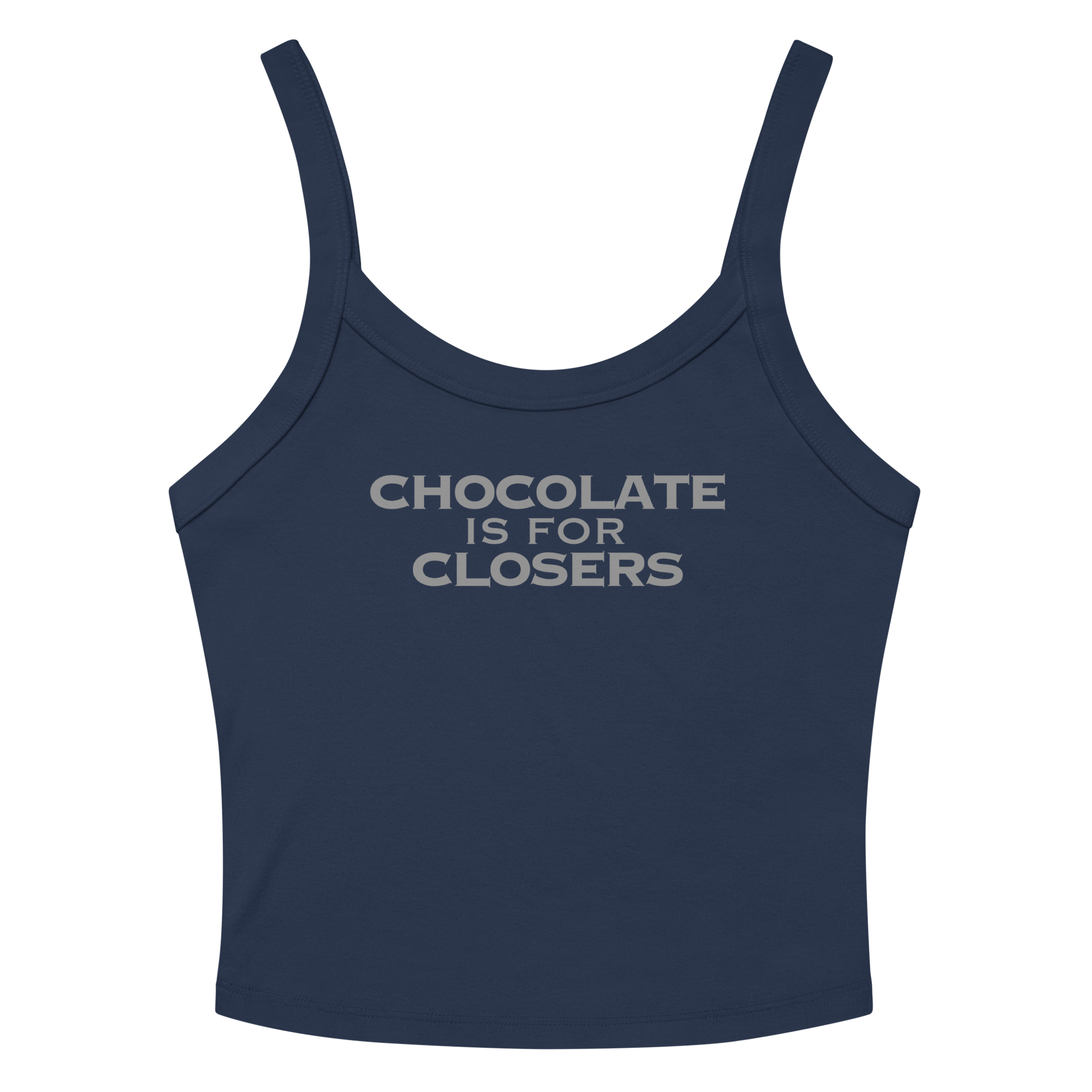 "Chocolate Is For Closers" printed on a solid navy blend women's micro-rib tanktop laying on a flat surface amongst sunglasses and shorts