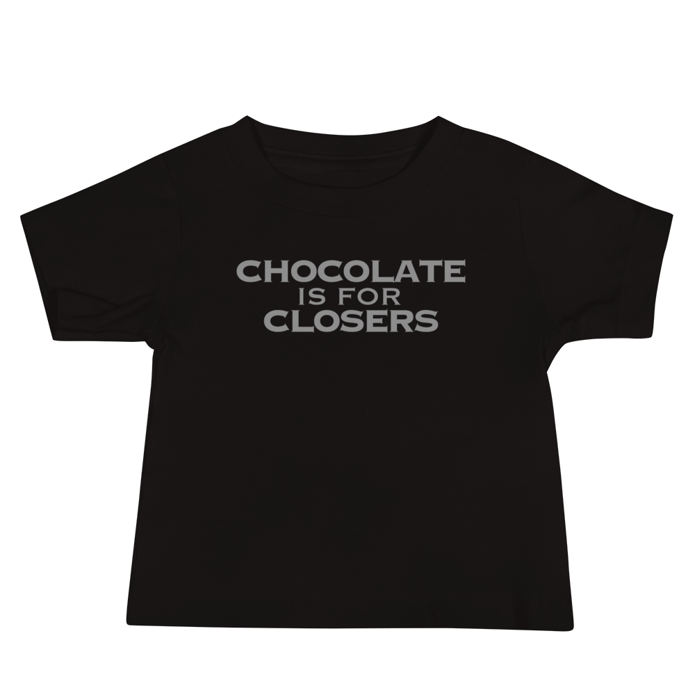 "Chocolate Is For Closers" printed on a black baby jersey short sleeve tee laying on a flat surface