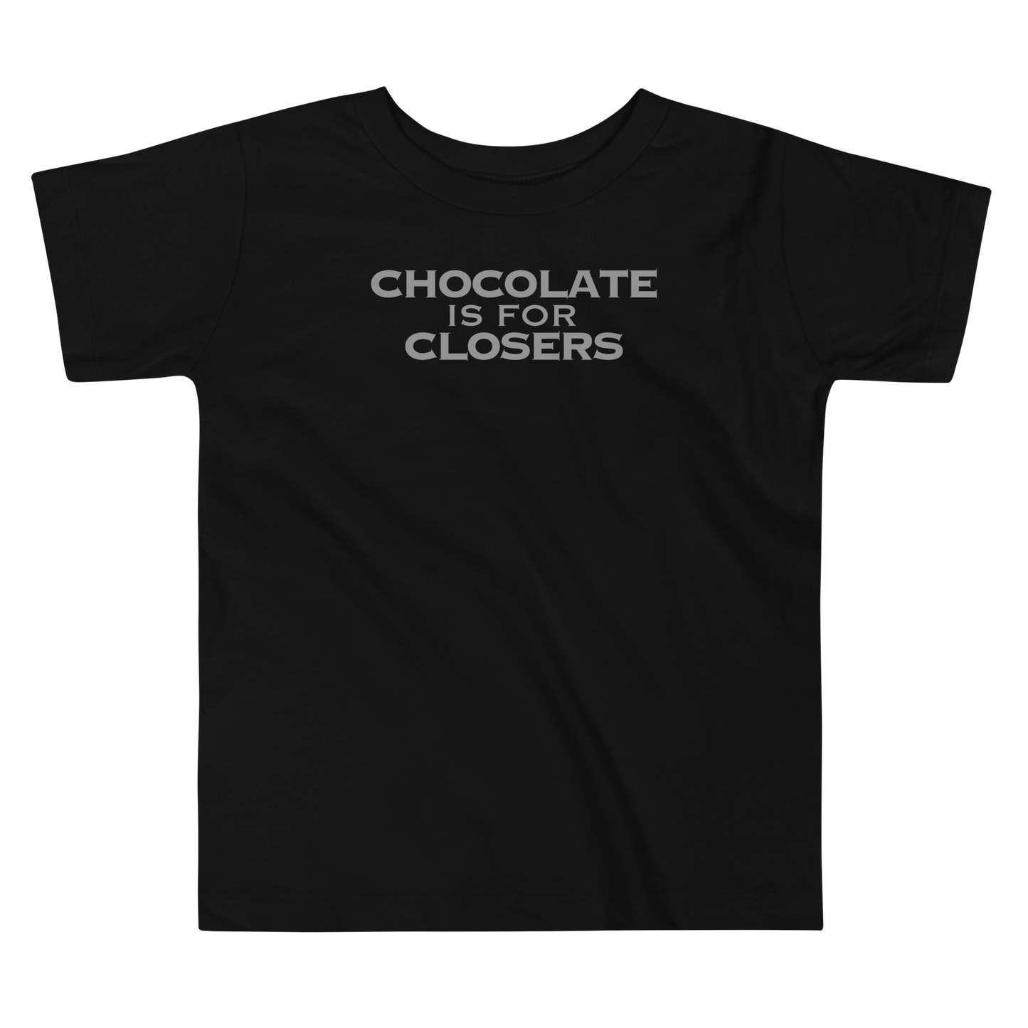 "Chocolate Is For Closers" printed on a black toddler short sleeve tee laying on a flat surface