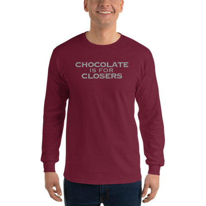 "Chocolate Is For Closers" printed on a maroon men's long sleeve shirt worn by a male