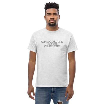 "Chocolate Is For Closers" printed on a ash unisex classic tee worn by a male