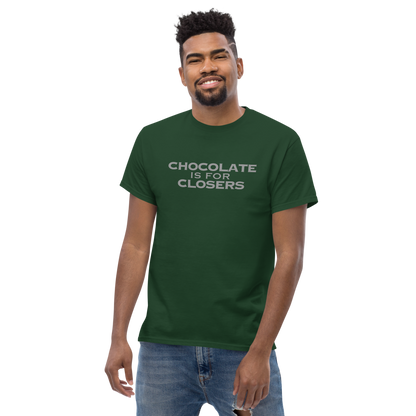 "Chocolate Is For Closers" printed on a forest green unisex classic tee worn by a male