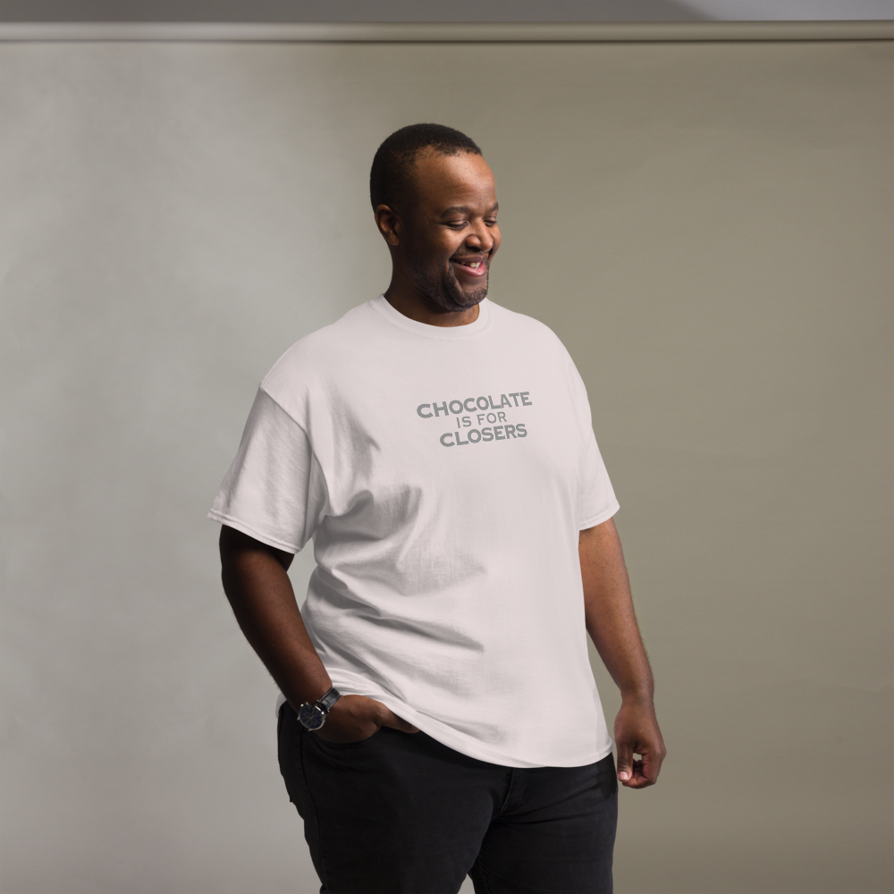 "Chocolate Is For Closers" printed on a ice grey unisex classic tee worn by a male