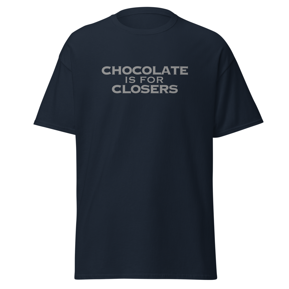 "Chocolate Is For Closers" printed on a navy unisex classic tee laying on a flat surface