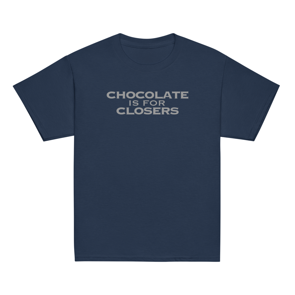 "Chocolate Is For Closers" printed on a navy youth classic tee laying on a flat surface