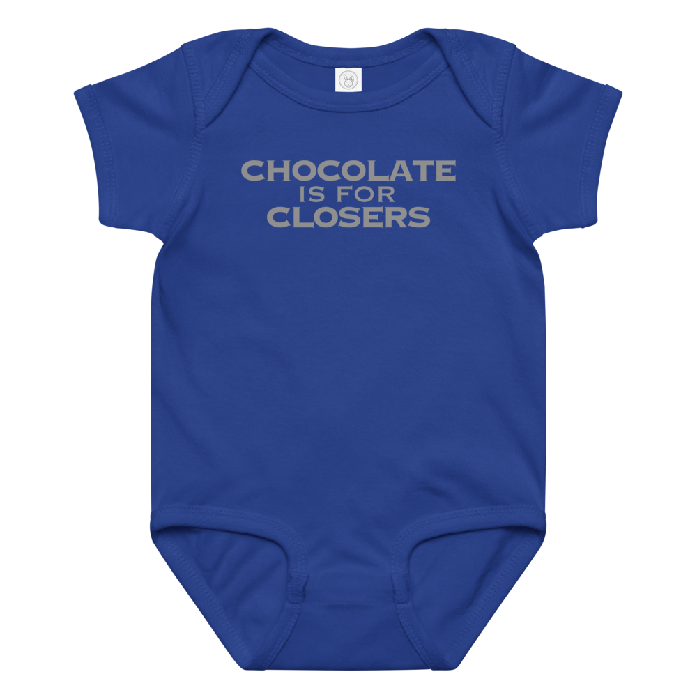 "Chocolate Is For Closers" printed on a royal baby jersey bodysuit laying on a flat surface amongst other clothes