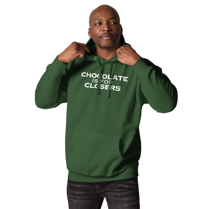 "Chocolate Is For Closers" printed on a forest green unisex hoodie worn by a male