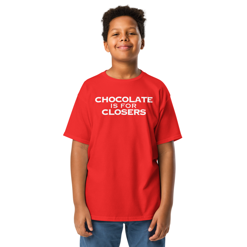 "Chocolate Is For Closers" printed on a red youth classic tee worn by a male
