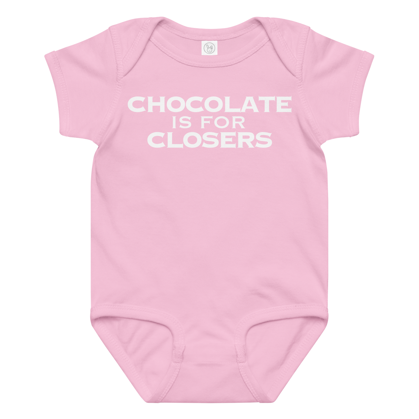 "Chocolate Is For Closers" printed on a pink baby jersey bodysuit laying on a flat surface amongst other clothes