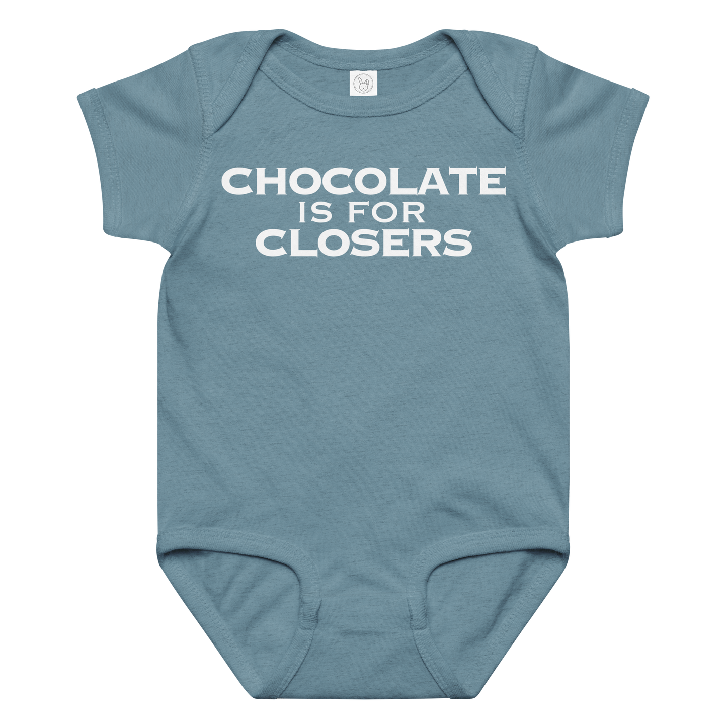 "Chocolate Is For Closers" printed on a vintage indigo baby jersey bodysuit laying on a flat surface amongst other clothes
