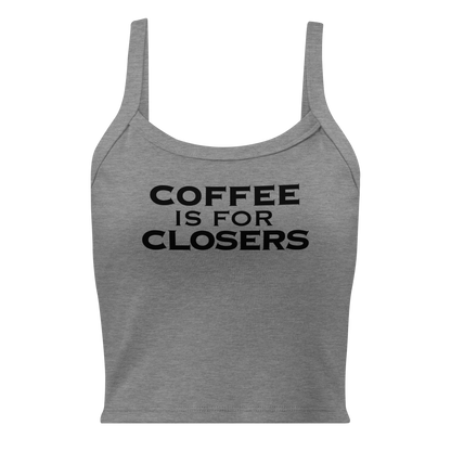 "Coffee Is For Closers" printed on a athletic heather women's micro-rib tanktop laying on a flat surface