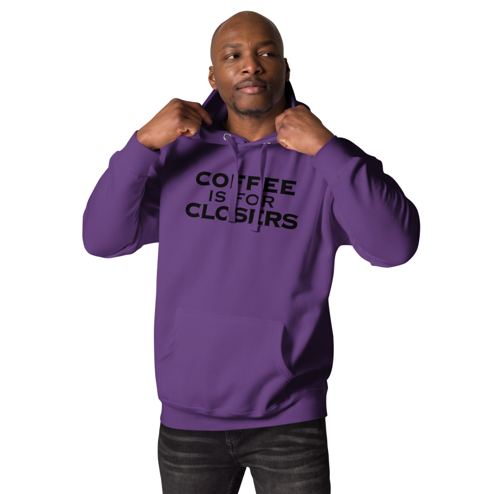 "Coffee Is For Closers" printed on a purple unisex hoodie worn by a male