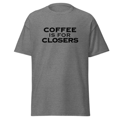 "Coffee Is For Closers" printed on a graphite heather unisex classic tee laying on a flat surface