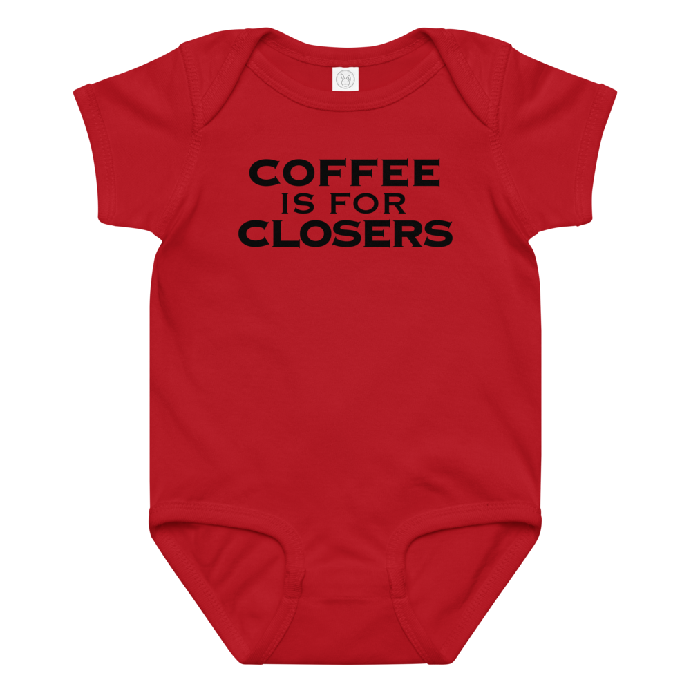 "Coffee Is For Closers" printed on a red baby jersey bodysuit laying on a flat surface amongst other clothes