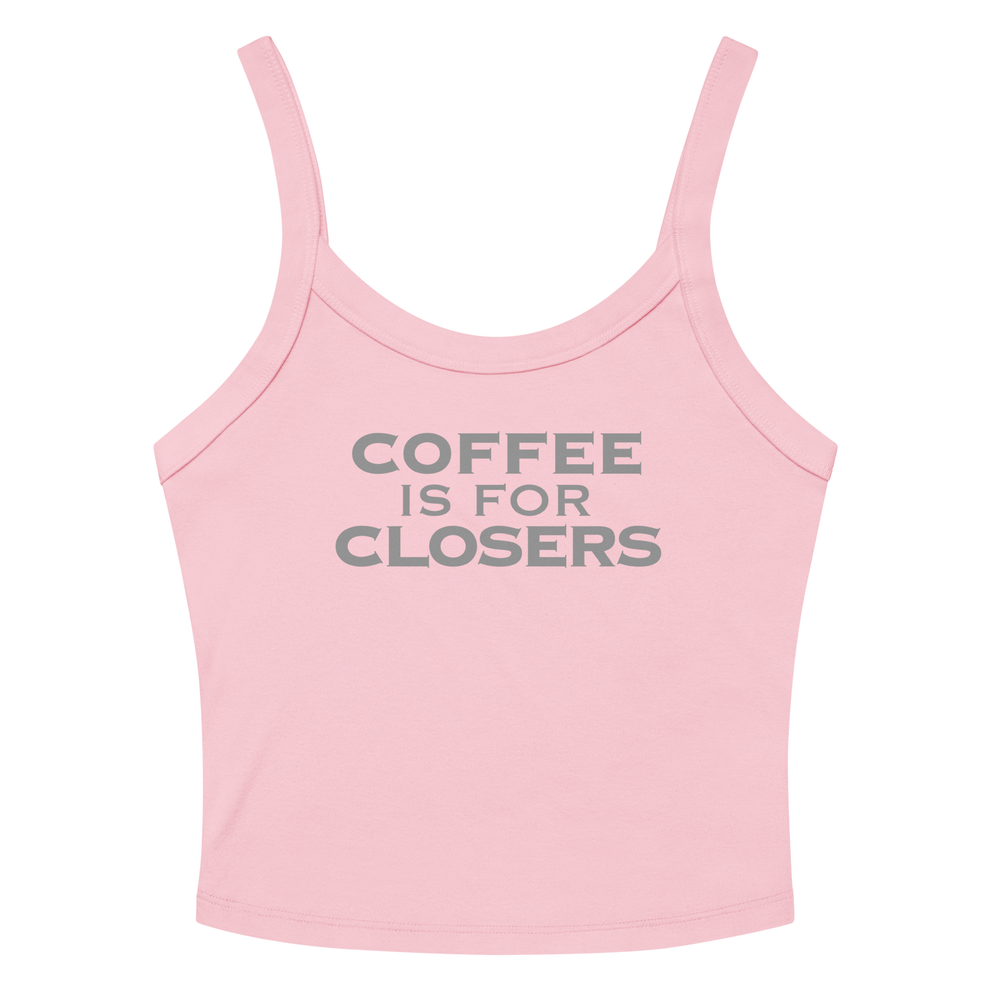 "Coffee Is For Closers" printed on a solid pink blend women's micro-rib tanktop laying on a flat surface amongst sunglasses and shorts